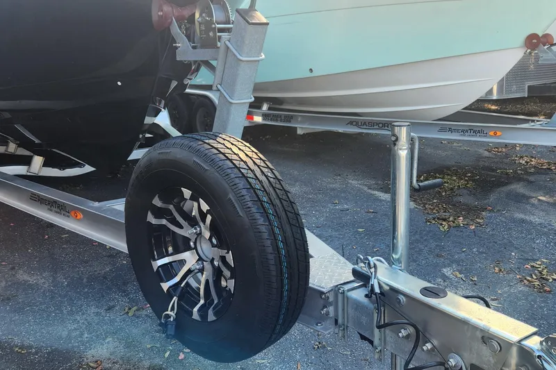 Slide: The Image of 2022 Pioneer 222 Islander boat on AmeraTrail trailer, featuring a stylish wheel design. - 24