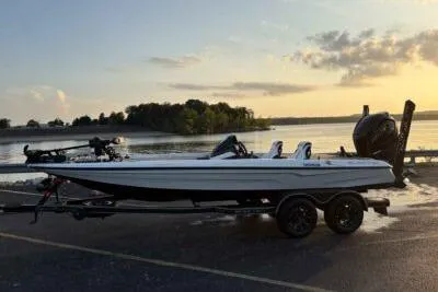 Slide: The Image of 2026 Skeeter ZXE20 boat at sunset by a serene lake. - 1