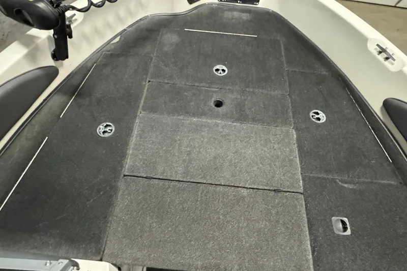 Slide: The Image of 2008 Ranger 1850 Reata boat deck with carpeted surface and storage compartments. - 11