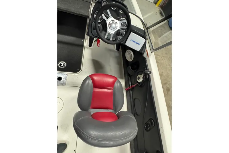 Slide: The Image of 2008 Ranger 1850 Reata boat interior with steering wheel and red-gray seat. - 6