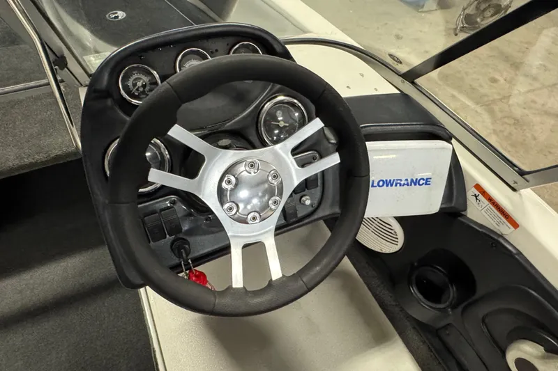 Slide: The Image of Steering wheel and dashboard of 2008 Ranger 1850 Reata boat with Lowrance system. - 7