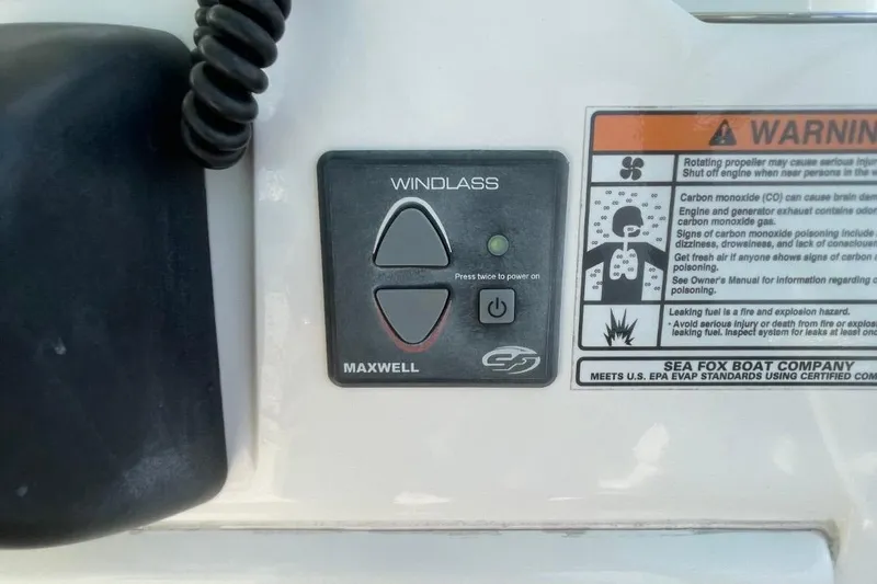 Slide: The Image of 2020 Sea Fox 248 Commander windlass control panel with safety warnings. - 14