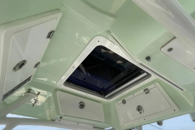 Slide: The Image of 2020 Sea Fox 248 Commander boat interior ceiling with storage compartments and hatch. - 19