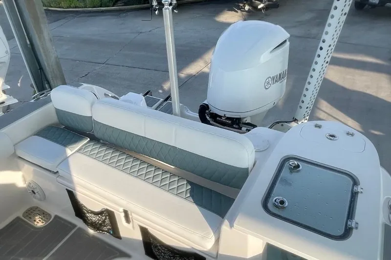 Slide: The Image of 2020 Sea Fox 248 Commander boat interior with Yamaha engine, featuring cushioned seating. - 20