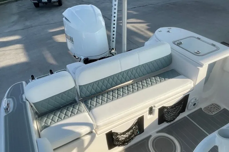 Slide: The Image of 2020 Sea Fox 248 Commander boat interior with cushioned seating and Yamaha engine. - 21