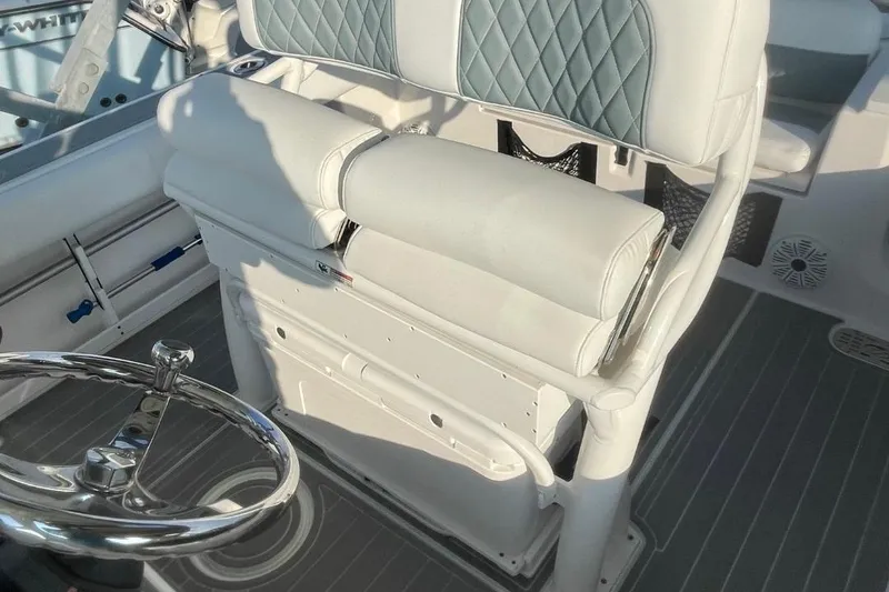 Slide: The Image of 2020 Sea Fox 248 Commander boat interior with cushioned seating and steering wheel. - 8