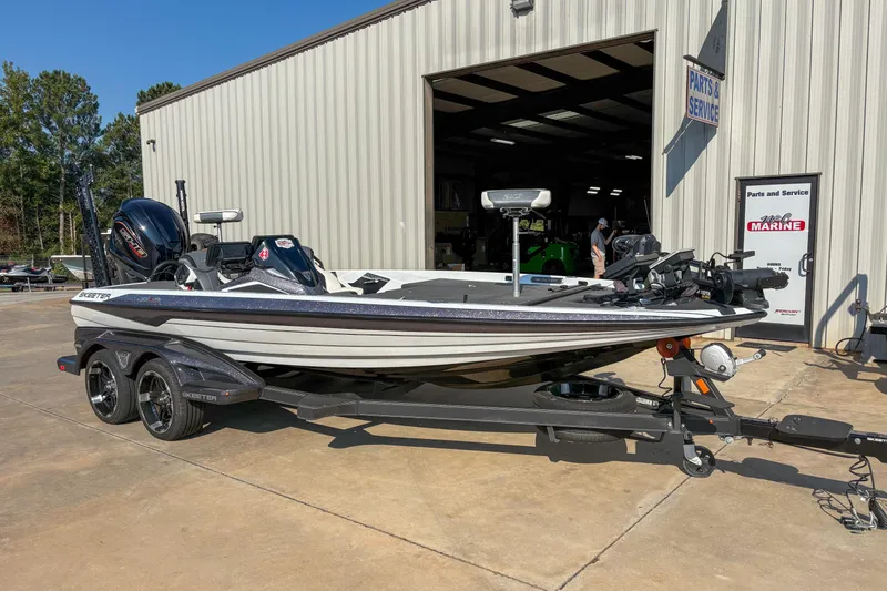 The Image of 2022 Skeeter FXR20 boat parked outside a service center on a sunny day. - 1