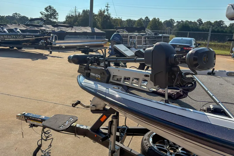 Slide: The Image of 2022 Skeeter FXR20 boat with Minn Kota Ultrex trolling motor in a parking lot. - 11