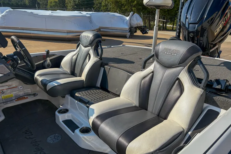 Slide: The Image of 2022 Skeeter FXR20 boat interior with dual seats and steering console. - 6