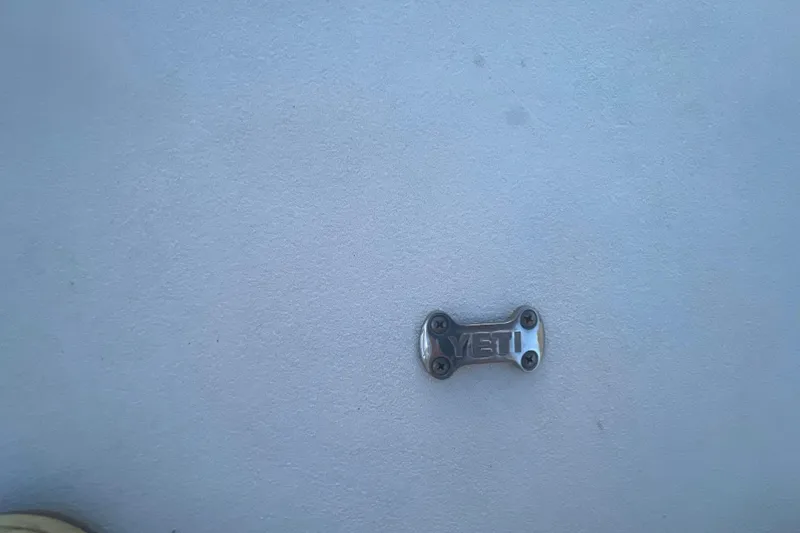 Slide: The Image of YETI metal fixture on 2007 Parker 2820 XLD Sport Cabin boat surface. - 103