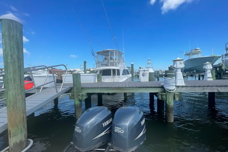 Slide: The Image of 2007 Parker 2820 XLD Sport Cabin docked at marina with Yamaha engines. - 14