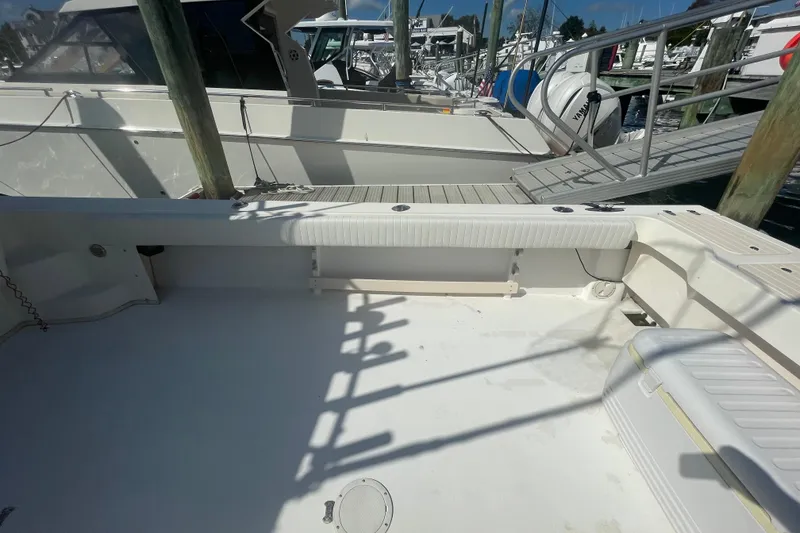 Slide: The Image of 2007 Parker 2820 XLD Sport Cabin boat docked, featuring spacious deck and seating area. - 31