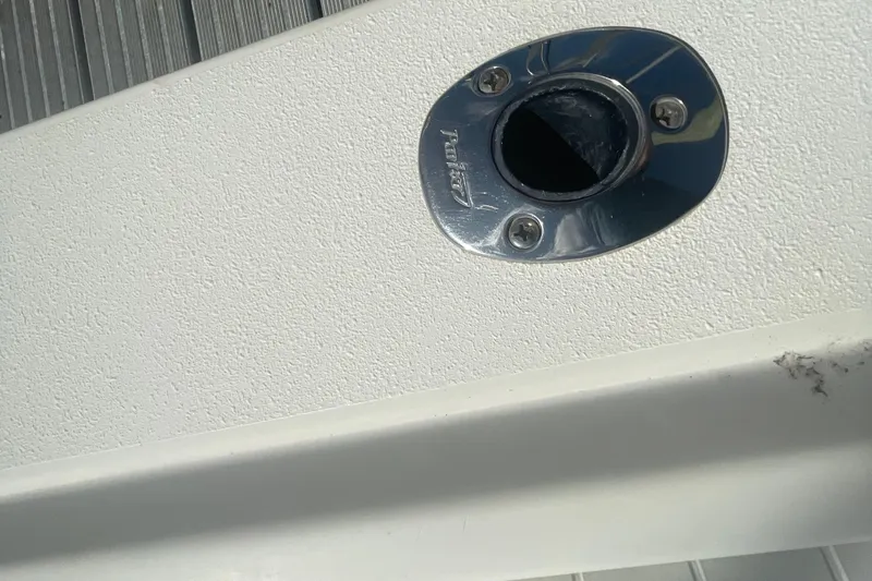 Slide: The Image of Close-up of a 2007 Parker 2820 XLD Sport Cabin boat's rod holder. - 32