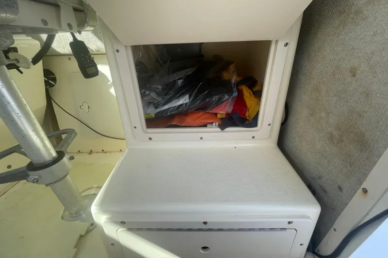 Slide: The Image of Storage compartment in a 2007 Parker 2820 XLD Sport Cabin boat interior. - 43