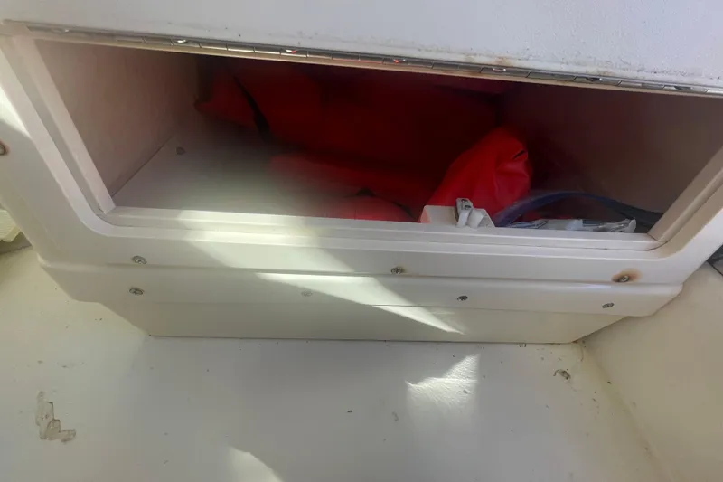 Slide: The Image of Storage compartment in 2007 Parker 2820 XLD Sport Cabin with life jackets inside. - 44