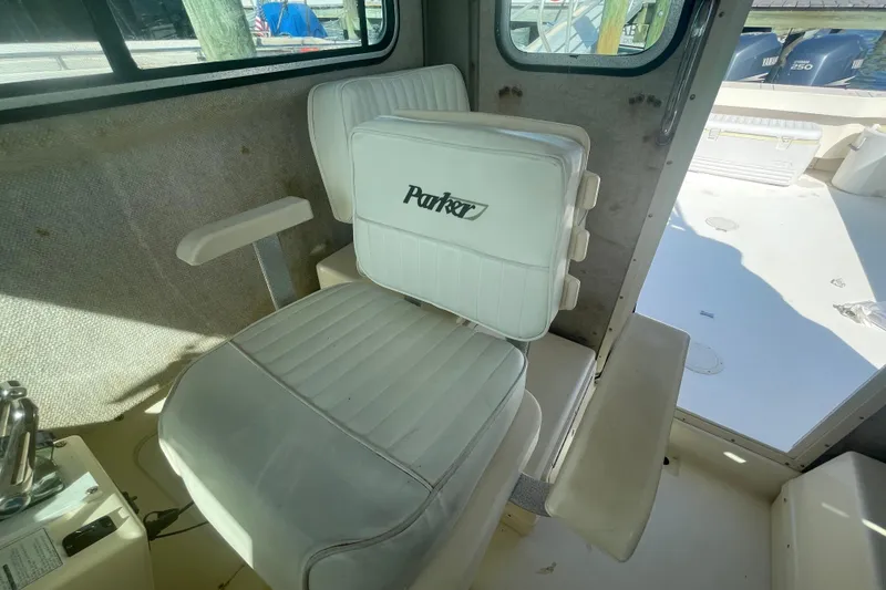 Slide: The Image of Interior of 2007 Parker 2820 XLD Sport Cabin with white seating and Parker logo. - 46