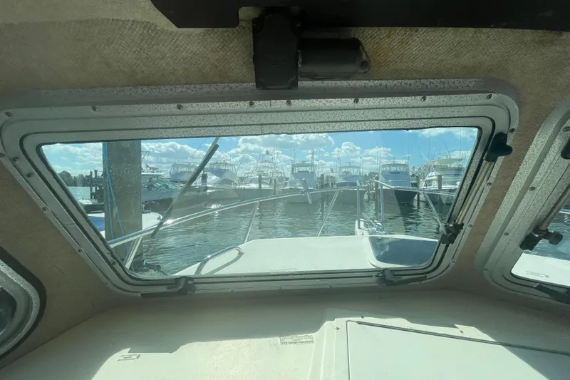 Slide: The Image of View from inside a 2007 Parker 2820 XLD Sport Cabin, overlooking a marina. - 49