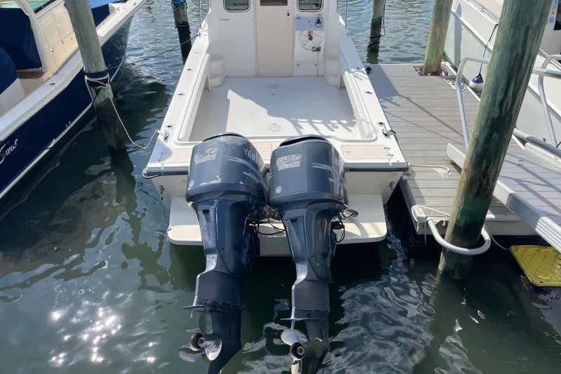Slide: The Image of 2007 Parker 2820 XLD Sport Cabin with twin Yamaha outboard motors docked at marina. - 5