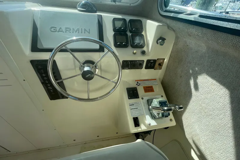 Slide: The Image of 2007 Parker 2820 XLD Sport Cabin helm with Garmin navigation and control panel. - 52