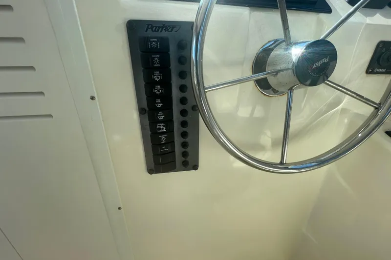 Slide: The Image of Steering wheel and control panel of 2007 Parker 2820 XLD Sport Cabin boat. - 53
