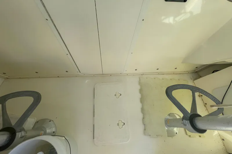 Slide: The Image of 2007 Parker 2820 XLD Sport Cabin interior with steering wheels and storage hatch. - 54