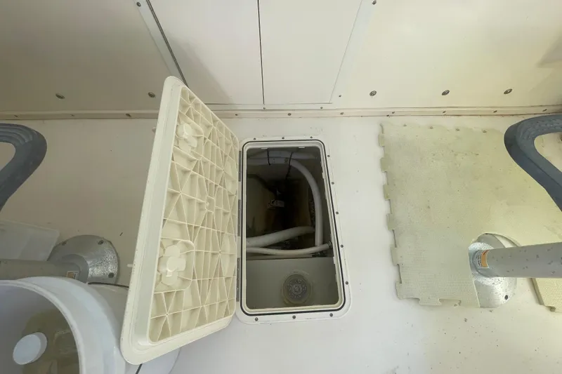 Slide: The Image of Open hatch in 2007 Parker 2820 XLD Sport Cabin boat, revealing interior compartment. - 55