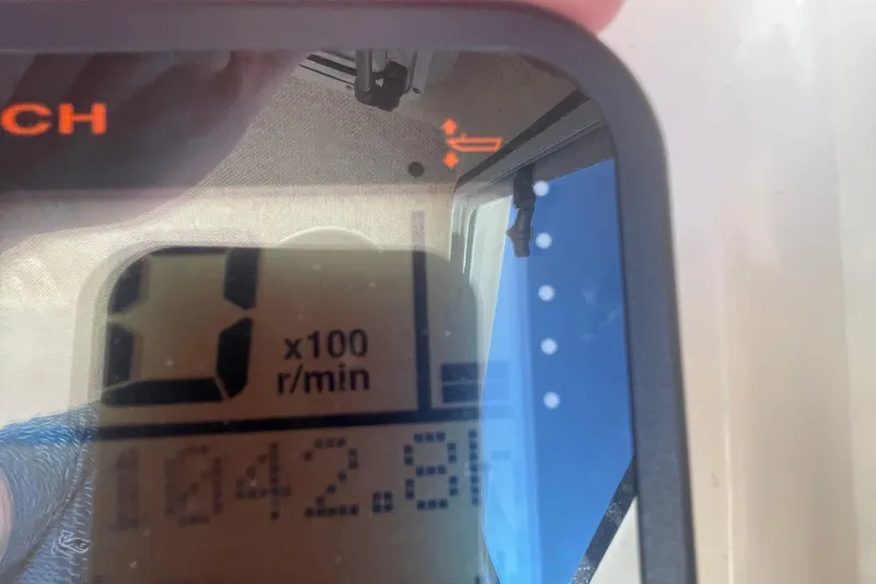 Slide: The Image of Close-up of a Parker 2820 XLD Sport Cabin 2007 tachometer displaying 1042.8 RPM. - 58