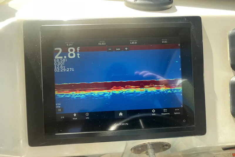 Slide: The Image of Garmin fishfinder display on 2007 Parker 2820 XLD Sport Cabin boat, showing depth and temperature. - 60