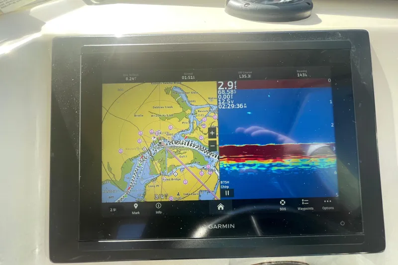 Slide: The Image of Garmin marine GPS display on 2007 Parker 2820 XLD Sport Cabin boat, showing navigation and sonar data. - 61