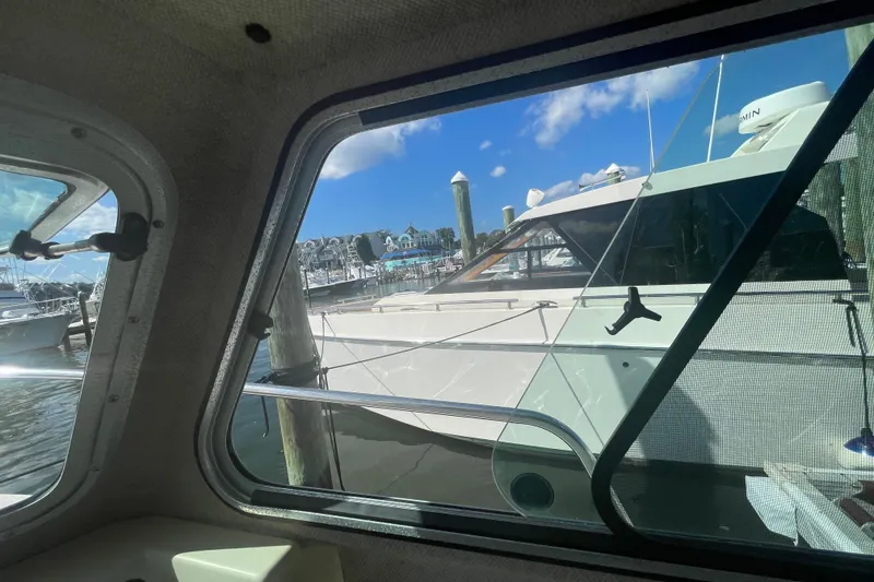 Slide: The Image of View from inside a 2007 Parker 2820 XLD Sport Cabin, overlooking a marina. - 65