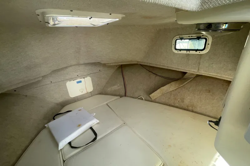 Slide: The Image of 2007 Parker 2820 XLD Sport Cabin interior with beige upholstery and small window. - 67
