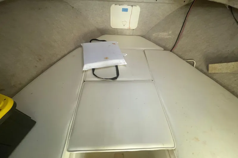 Slide: The Image of 2007 Parker 2820 XLD Sport Cabin interior with cushioned seating and storage compartment. - 70