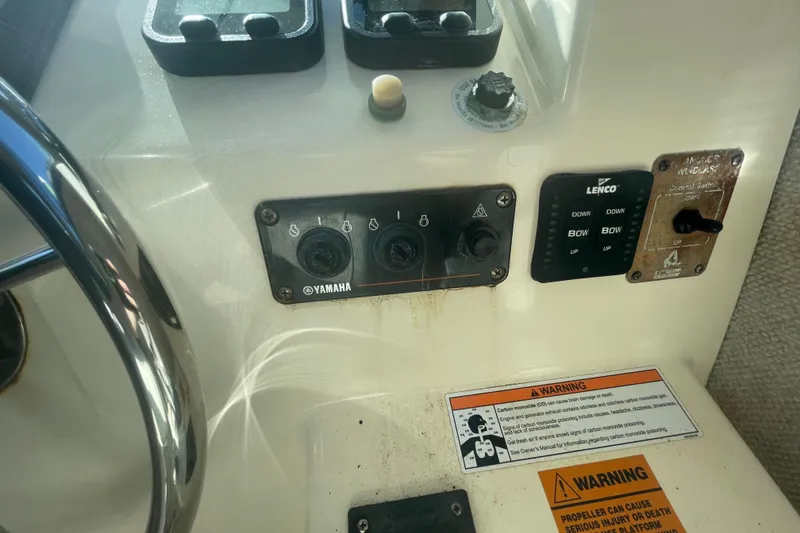 Slide: The Image of Control panel of a 2007 Parker 2820 XLD Sport Cabin boat with Yamaha switches. - 76