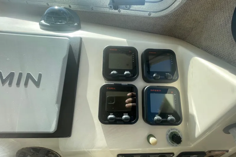 Slide: The Image of Dashboard of a 2007 Parker 2820 XLD Sport Cabin with Garmin and Yamaha gauges. - 77