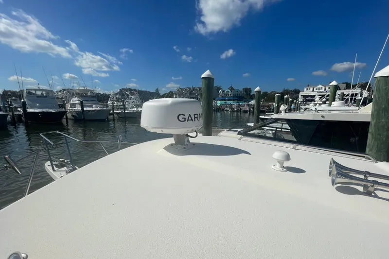Slide: The Image of 2007 Parker 2820 XLD Sport Cabin boat docked at marina under clear blue sky. - 81