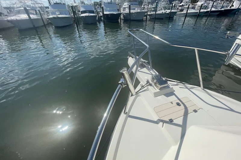 Slide: The Image of 2007 Parker 2820 XLD Sport Cabin boat docked in marina, sunny day reflections on water. - 85