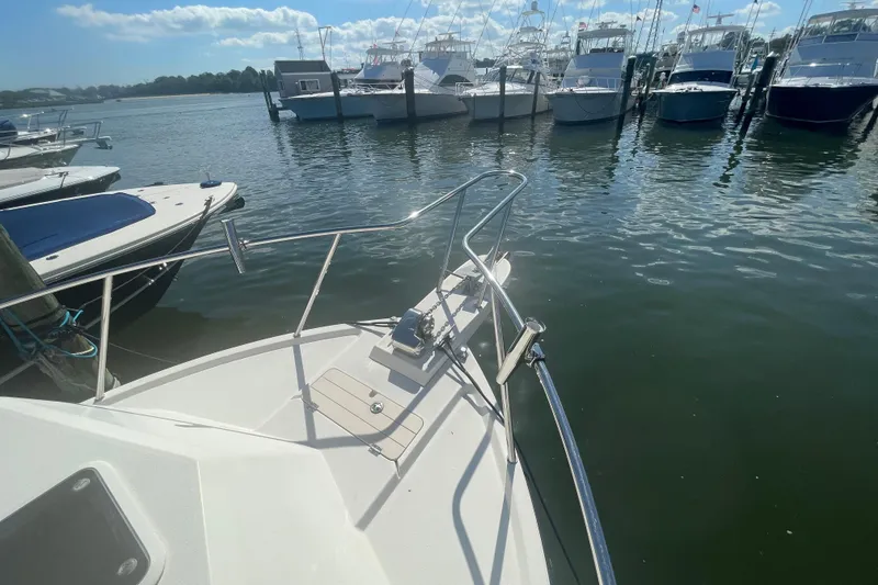 Slide: The Image of 2007 Parker 2820 XLD Sport Cabin docked at marina with other boats. - 89