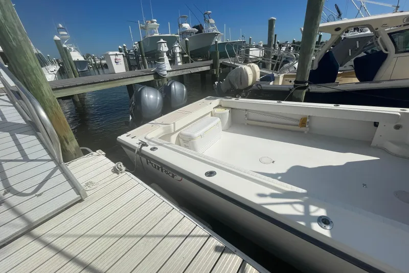 Slide: The Image of 2007 Parker 2820 XLD Sport Cabin boat docked at marina with clear blue sky. - 9