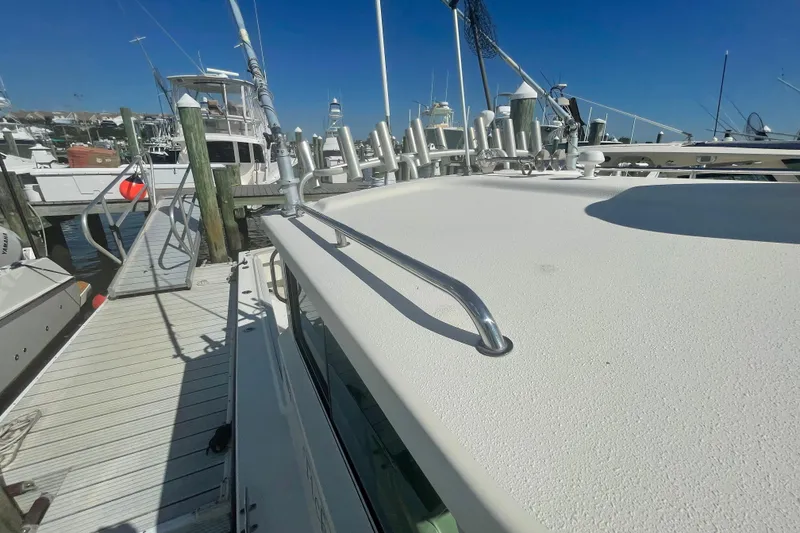 Slide: The Image of 2007 Parker 2820 XLD Sport Cabin docked at marina under clear blue sky. - 98