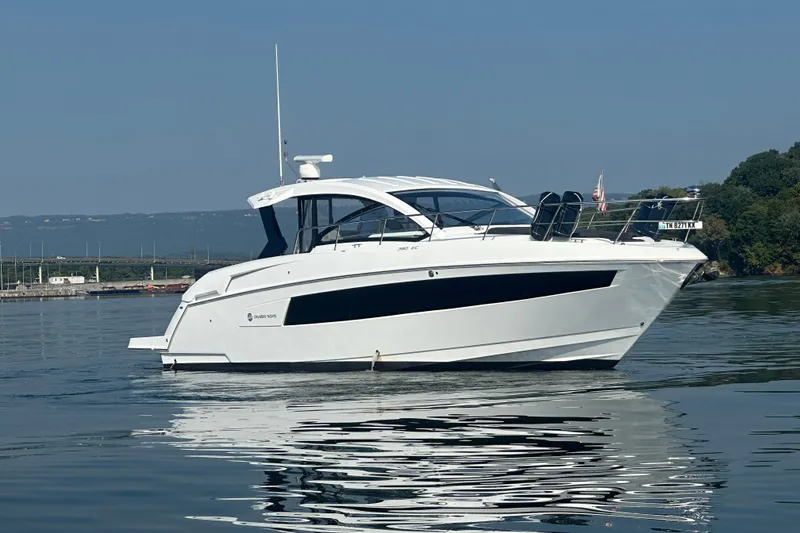 Slide: The Image of 2022 Cruisers Yachts 390 Express Coupe on calm water, side view. - 16