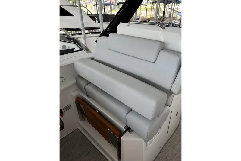 Slide: The Image of 2022 Cruisers Yachts 390 Express Coupe interior with luxurious gray seating. - 5