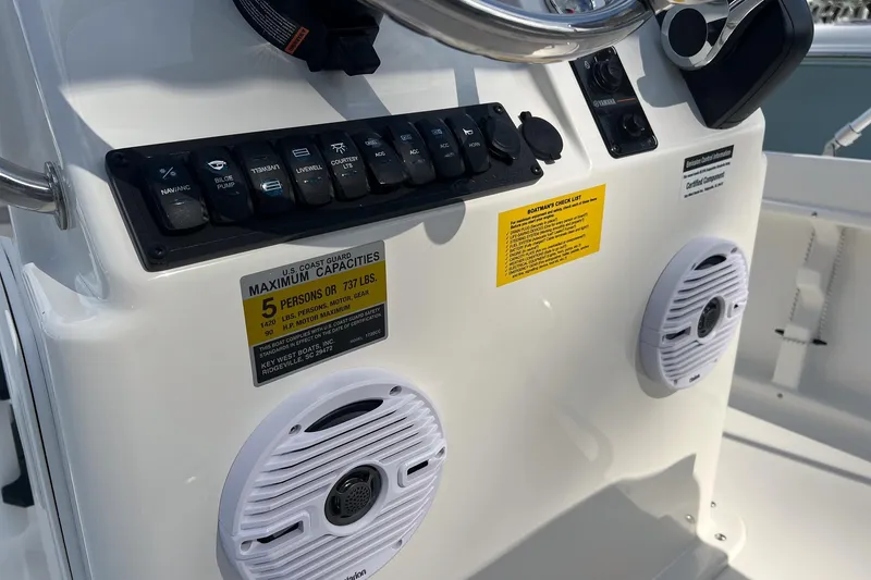 Slide: The Image of 2026 Key West 1720 Center Console dashboard with controls and capacity label. - 11