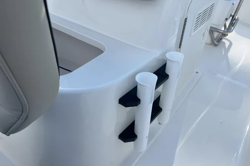 Slide: The Image of 2026 Key West 1720 Center Console boat with rod holders and storage compartment. - 19