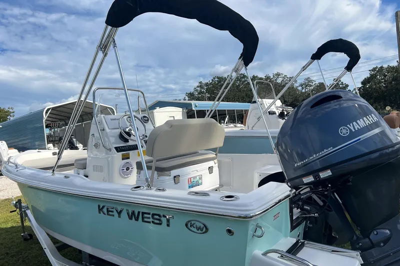 Slide: The Image of 2026 Key West 1720 Center Console boat with Yamaha engine, parked outdoors. - 3