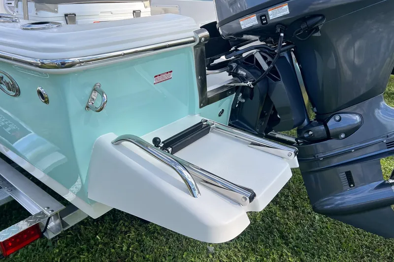 Slide: The Image of 2026 Key West 1720 Center Console boat with outboard motor and swim platform. - 4