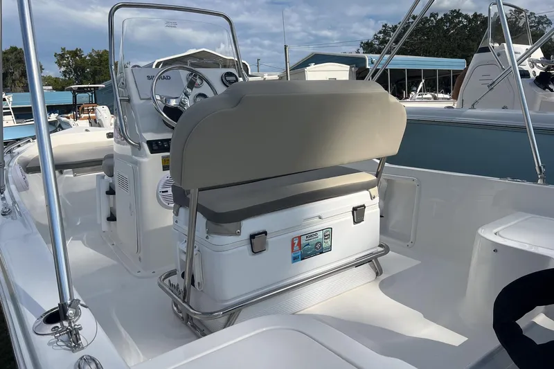 Slide: The Image of 2026 Key West 1720 Center Console boat interior with steering wheel and seating. - 7