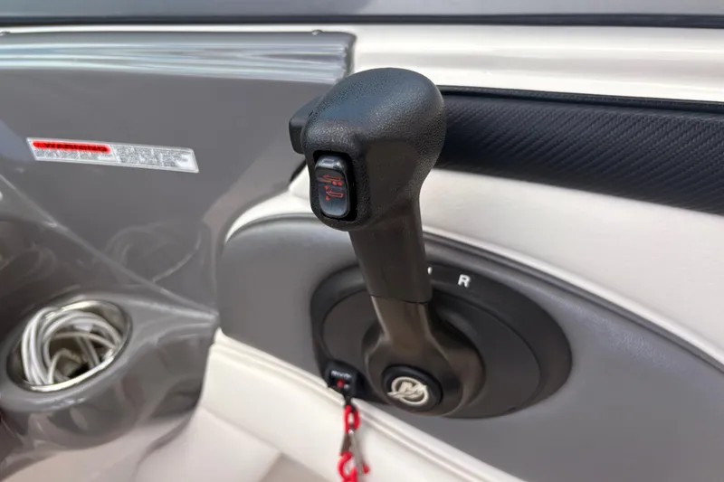 Slide: The Image of Throttle control lever on a 2011 Monterey 204FS boat dashboard. - 21