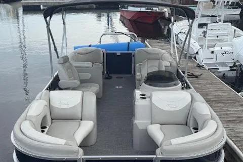Slide: The Image of 2015 Sylvan Mirage Cruise 8522 LZ pontoon boat with spacious seating at a marina dock. - 11