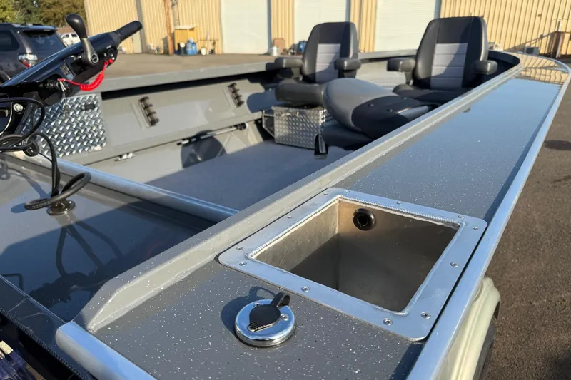Slide: The Image of 2026 Fish Rite River Master 18 boat interior with seating and control panel. - 10