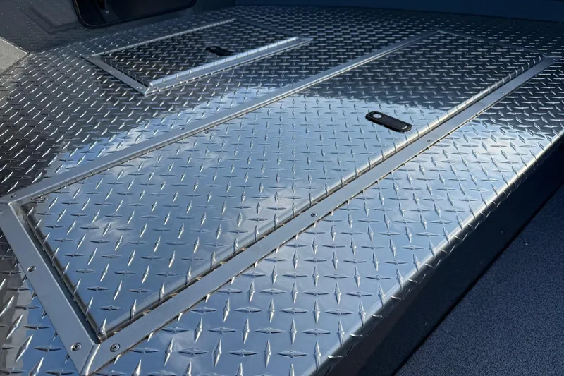 Slide: The Image of Diamond plate deck of 2026 Fish Rite River Master 18 boat. - 20